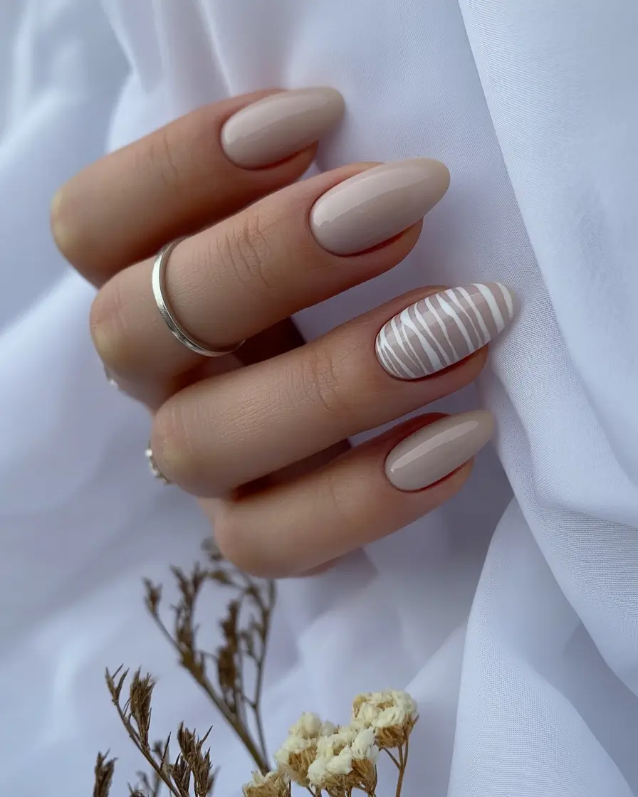 almond nails Soft Nude Almonds With Subtle Striped Accent