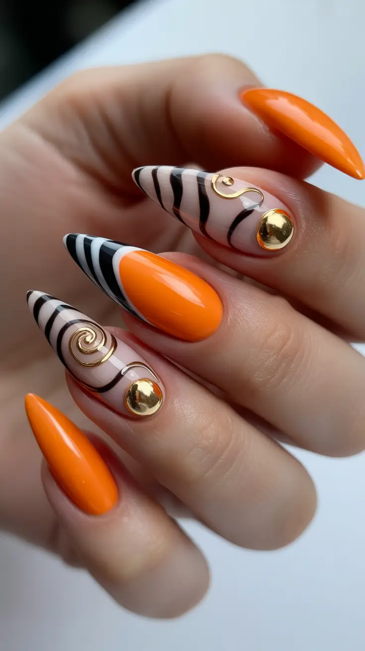 trendy spring nails Orange glam with graphic gold accents