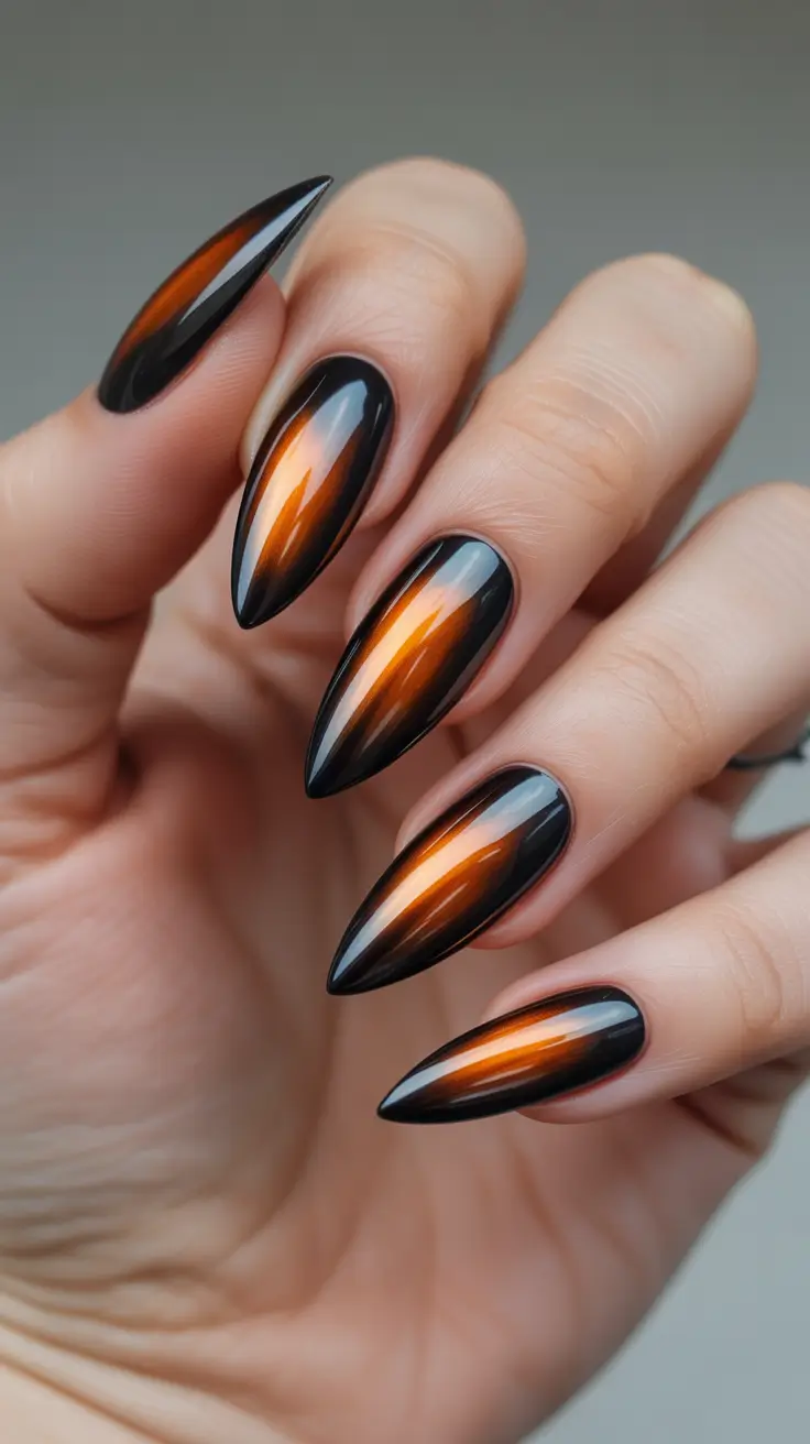 spring long nails Glossy Black and Amber Flame Stiletto Nails for Dramatic Spring Style