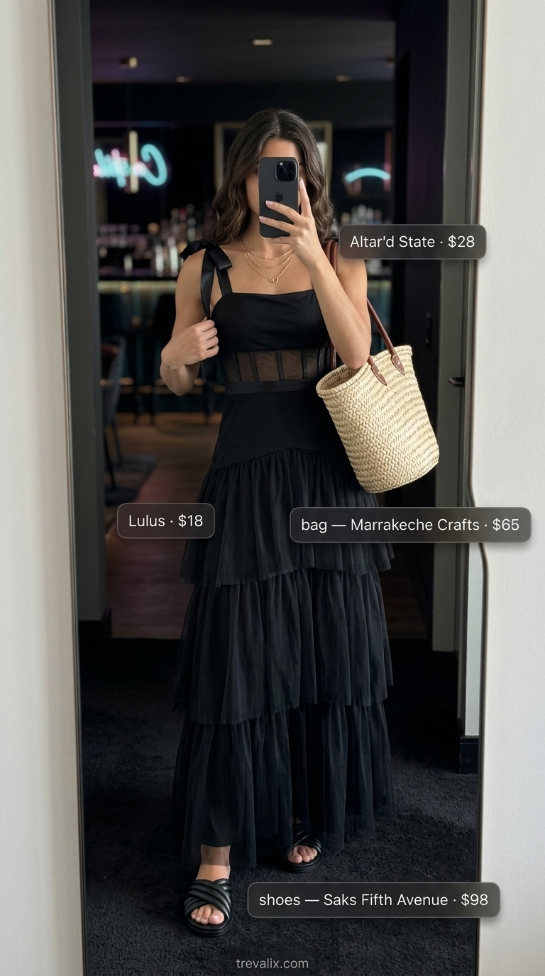 All black summer night outfits 2026: Ethereal flowy black maxi dress, straw tote, leather slides, and delicate gold necklaces for a relaxed vibe.