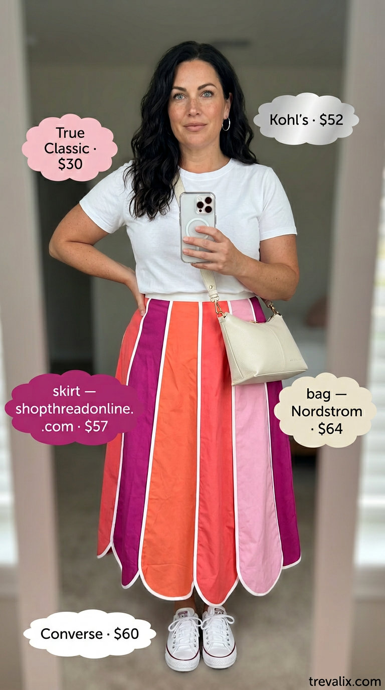 Bold curvy outfit summer for women 2026: Magenta and orange color block midi skirt with a white tee and sneakers.