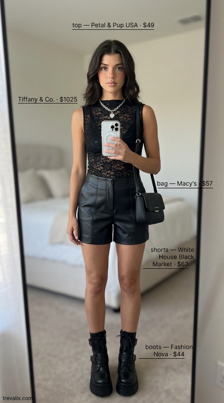Edgy street style with a black eyelet lace sleeveless top, faux leather shorts, and chunky combat boots.