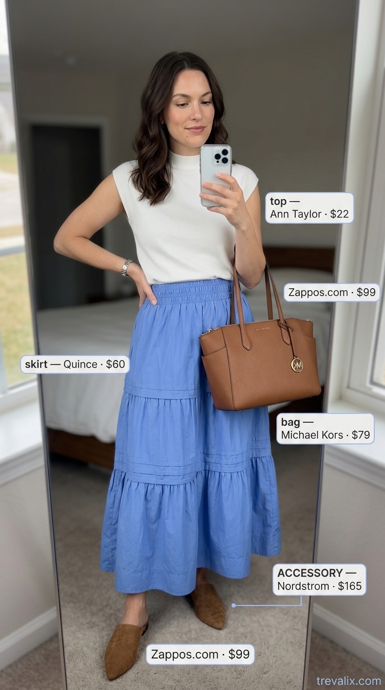 Polished Summer Friday Tiered Maxi Skirt Outfits Summer 2026 Polished summer outfit: light blue tiered maxi skirt, white knit top, tan mules for casual office or smart casual events.