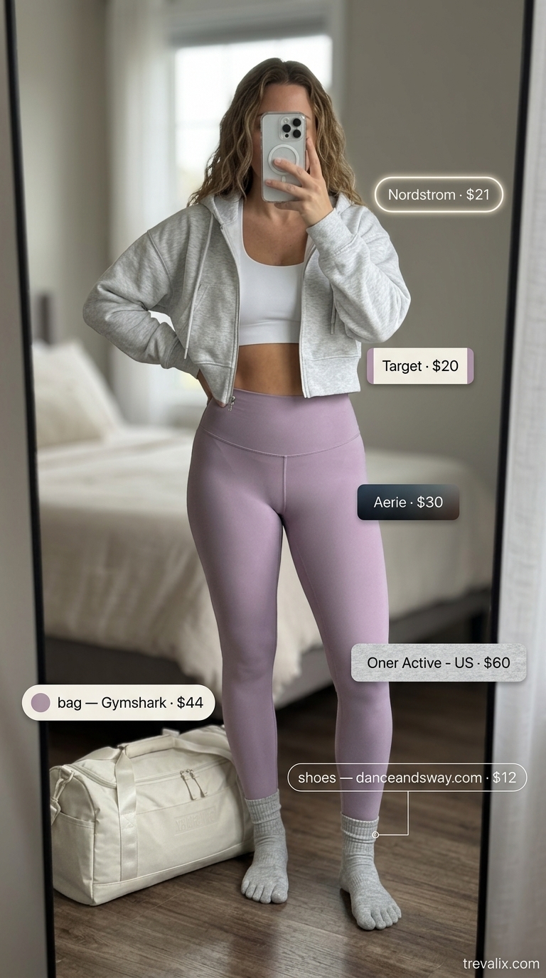 Trendy summer activewear for women 2026: Lilac leggings, grey zip-up, white sports bra, grey socks, grey duffel.