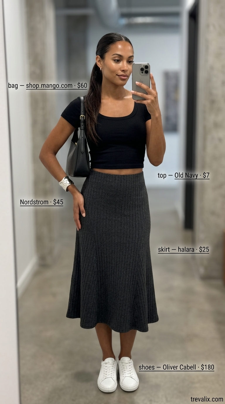 Trendy summer streetwear for women 2026: Black midi skirt, black crop top, white sneakers, and crossbody bag.