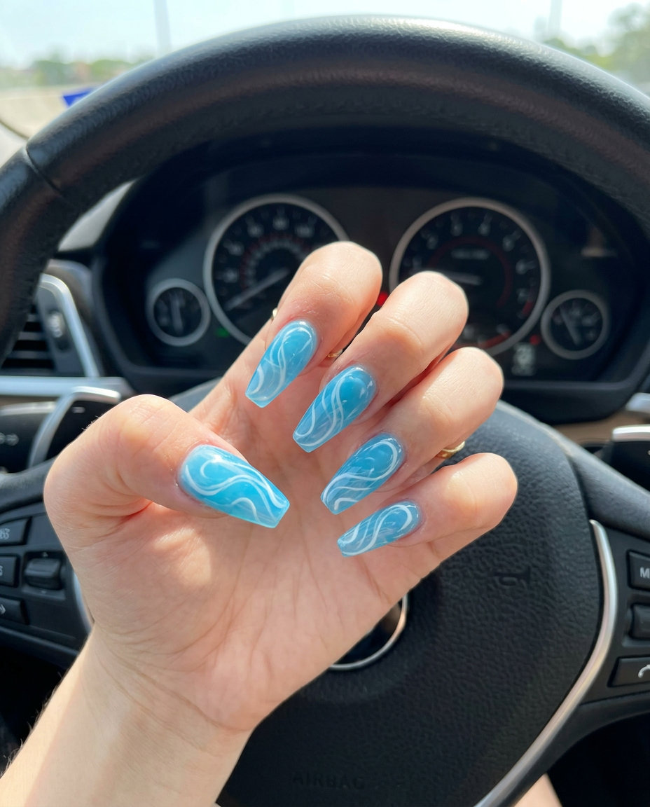 Icy blue swirls jelly coffin nails for cute summer nails 2026. Ideal for vacations and summer parties.