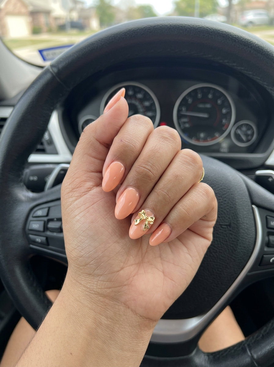 Cute summer nails 2026: Peach fuzz 3D bow almond for date night and bridal showers.