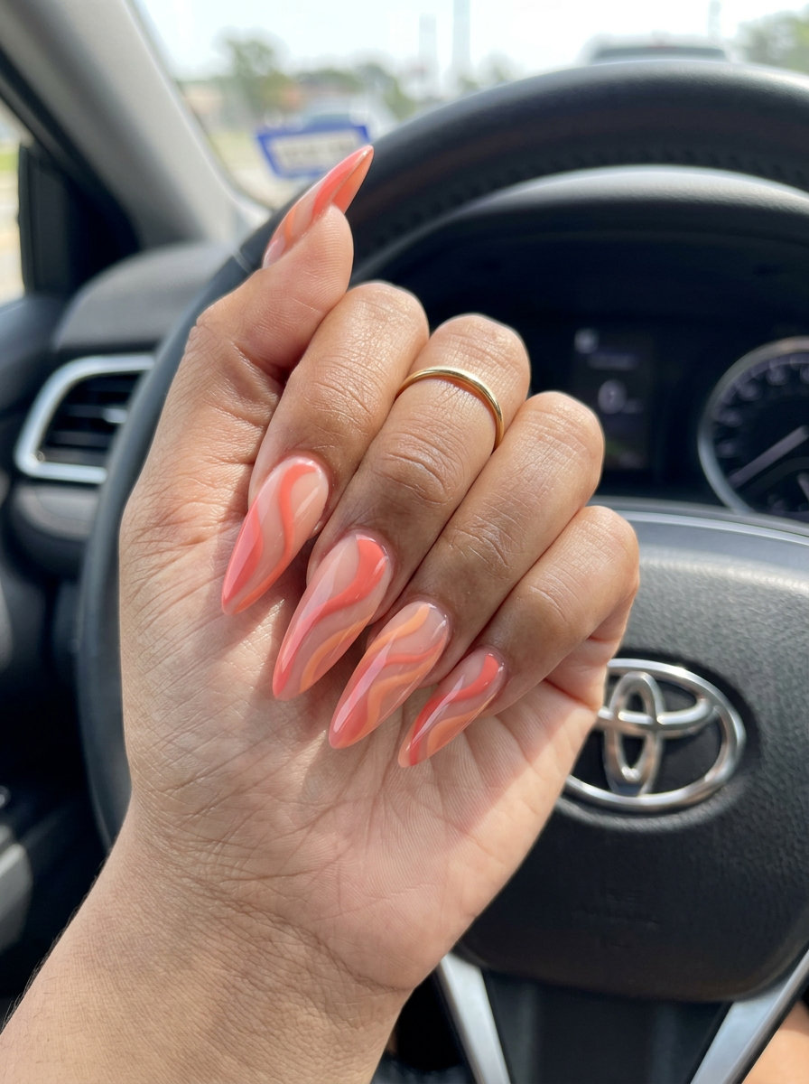 Coral & Peach Swirl Nails - Summer 2026 Fun Coral & Peach Abstract Swirls nails for festival outfits. Best for summer 2026.