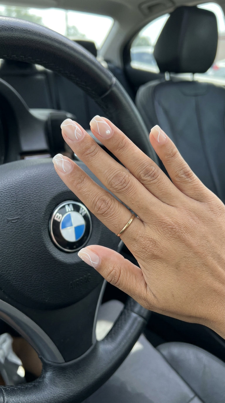 June Nails Ideas: Nude Lines Pearl Accent 2026 Minimalist nude lines with pearl accent nails for summer 2026. Chic for work and daily wear.