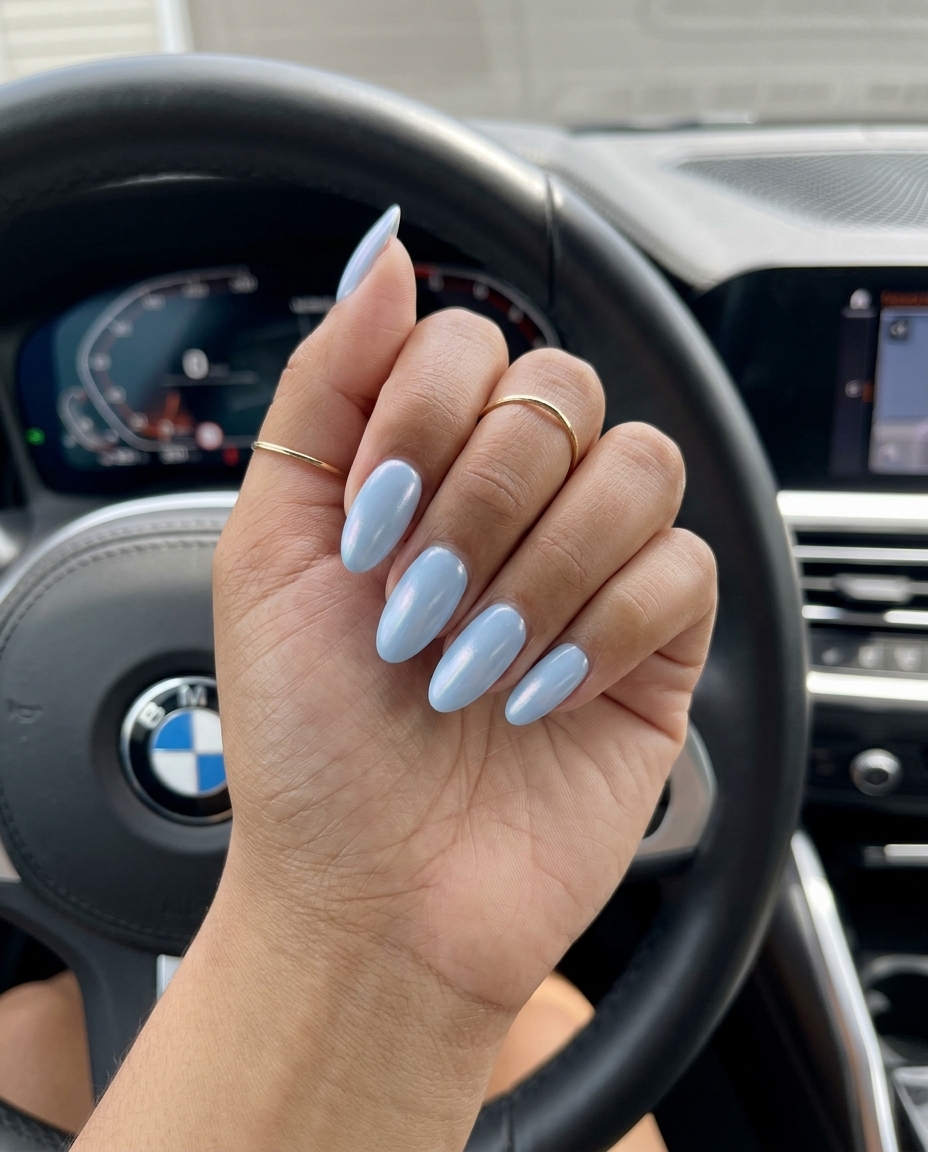 Baby Blue Oval Nails 2026: Whimsical Vacation Style Baby Blue Pearlescent Oval: Whimsical vacation nails in soft baby blue shimmer. Oval summer nails 2026.