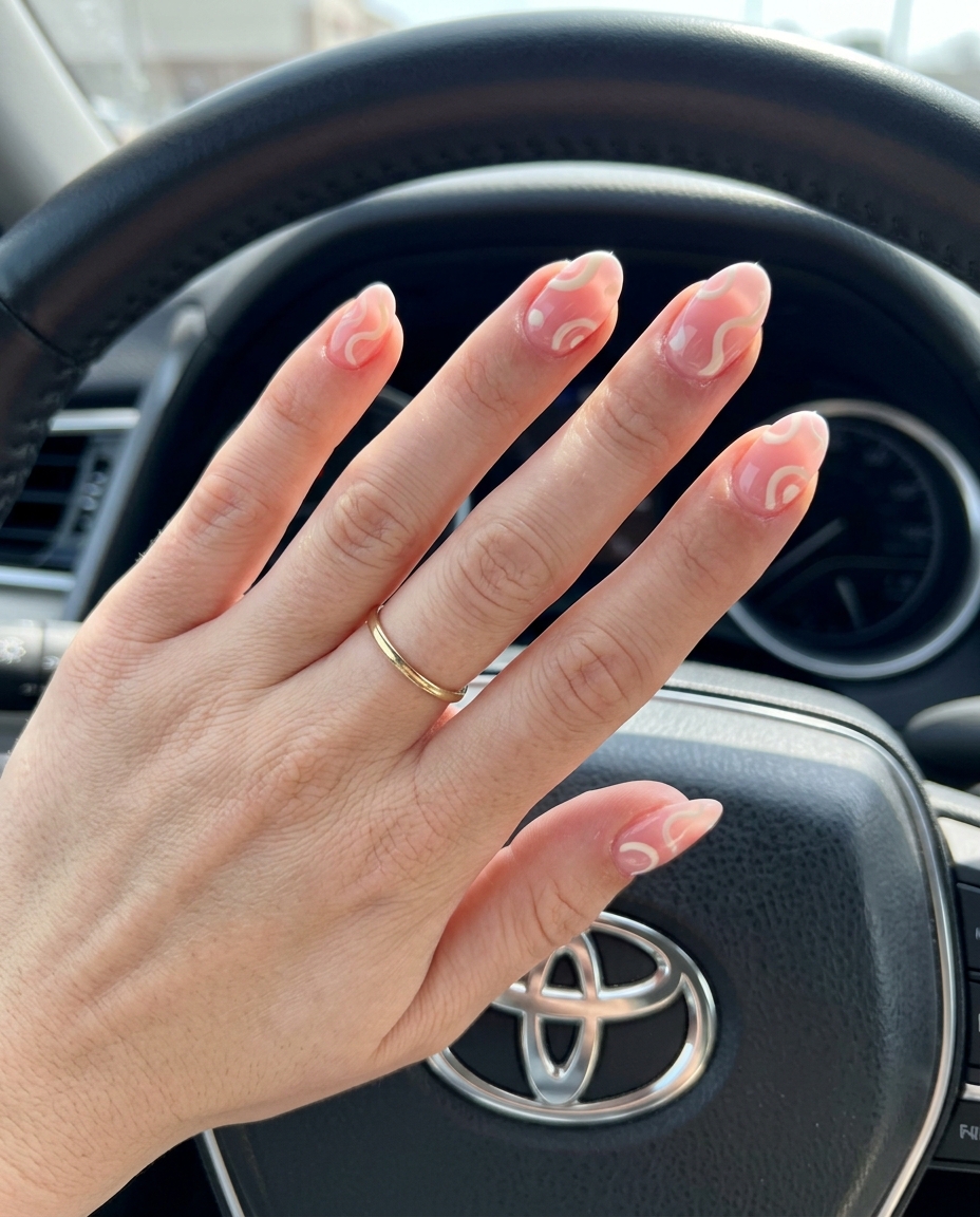 Sheer pink swirl acrylic nails for weddings, bridal showers, or romantic dates. Simple summer acrylic nail designs 2026.
