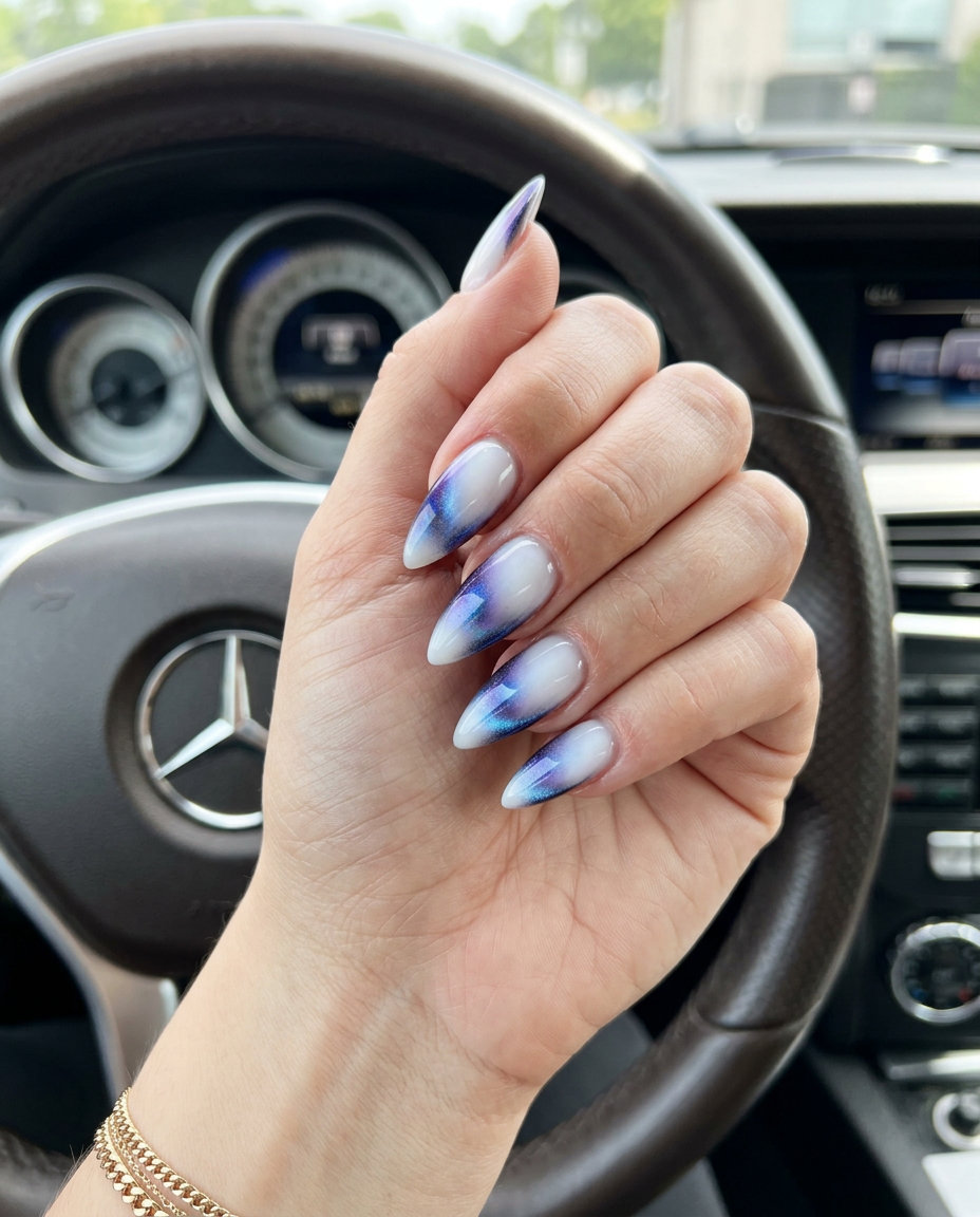 Milky white stiletto summer nails 2026 with a mystic cat-eye effect for a glamorous date night.