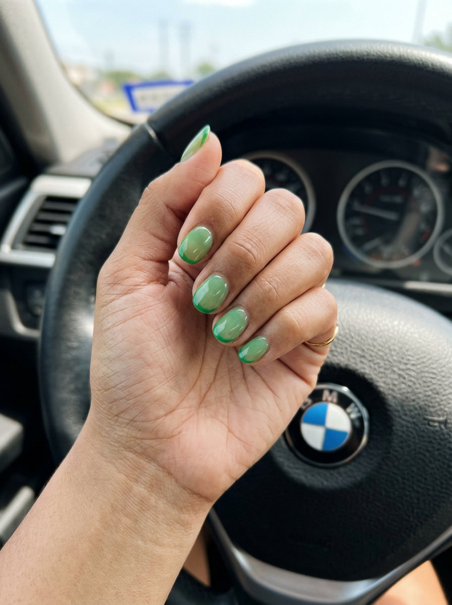 Bold lime green chrome swirls on stiletto nails with white accents for summer citrus nail art 2026.