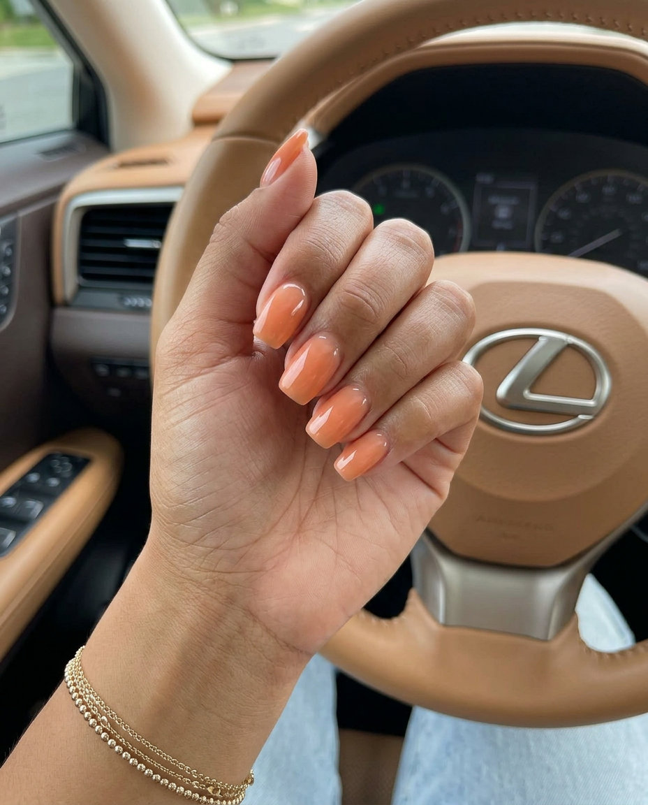 Summer Classy Nails 2026: Milky Coral Almond Subtle Coral Milky Bath nails for summer classy nails 2026: sheer milky white with muted coral undertones on almond shape.