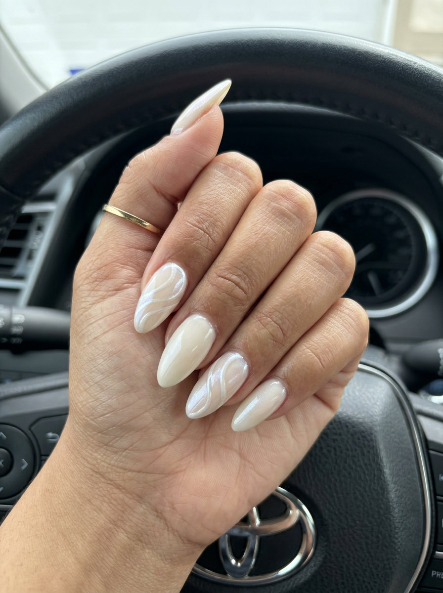 Off-White Pearlescent Swirl Nails 2026 Off-white pearlescent swirls nails for summer classy nails 2026 party and date night.
