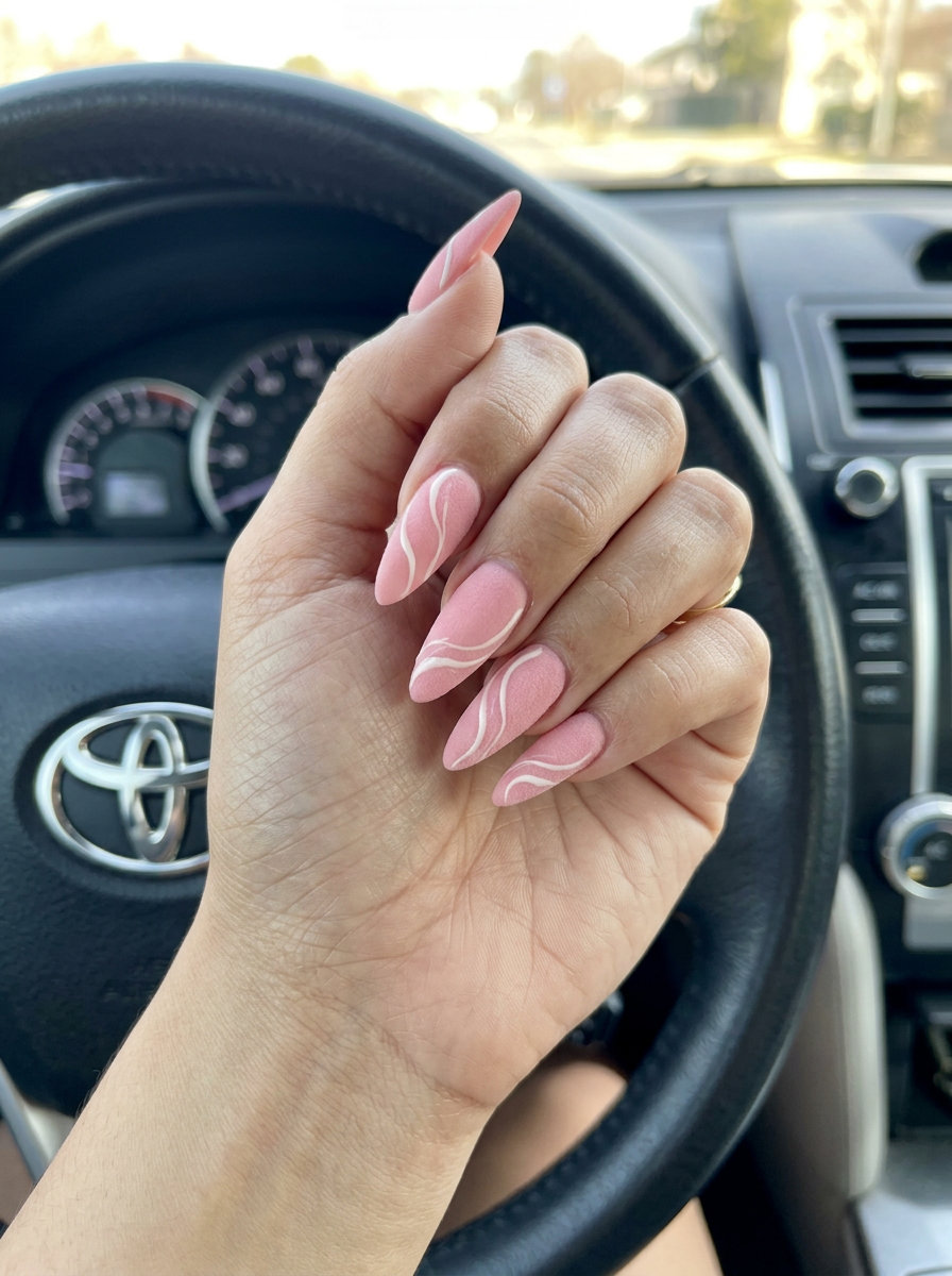 Strawberry Pink Velvet Swirls nails: soft pink velvet matte with creamy white abstract swirls. Summer fruits nail art 2026.