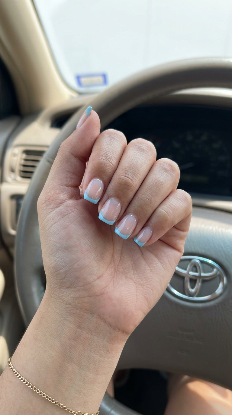 Summer Gel Nails 2026: Blue Negative Space Short simple summer gel nails 2026: Sky Blue Negative Space French for casual wear. Refreshing & chic.
