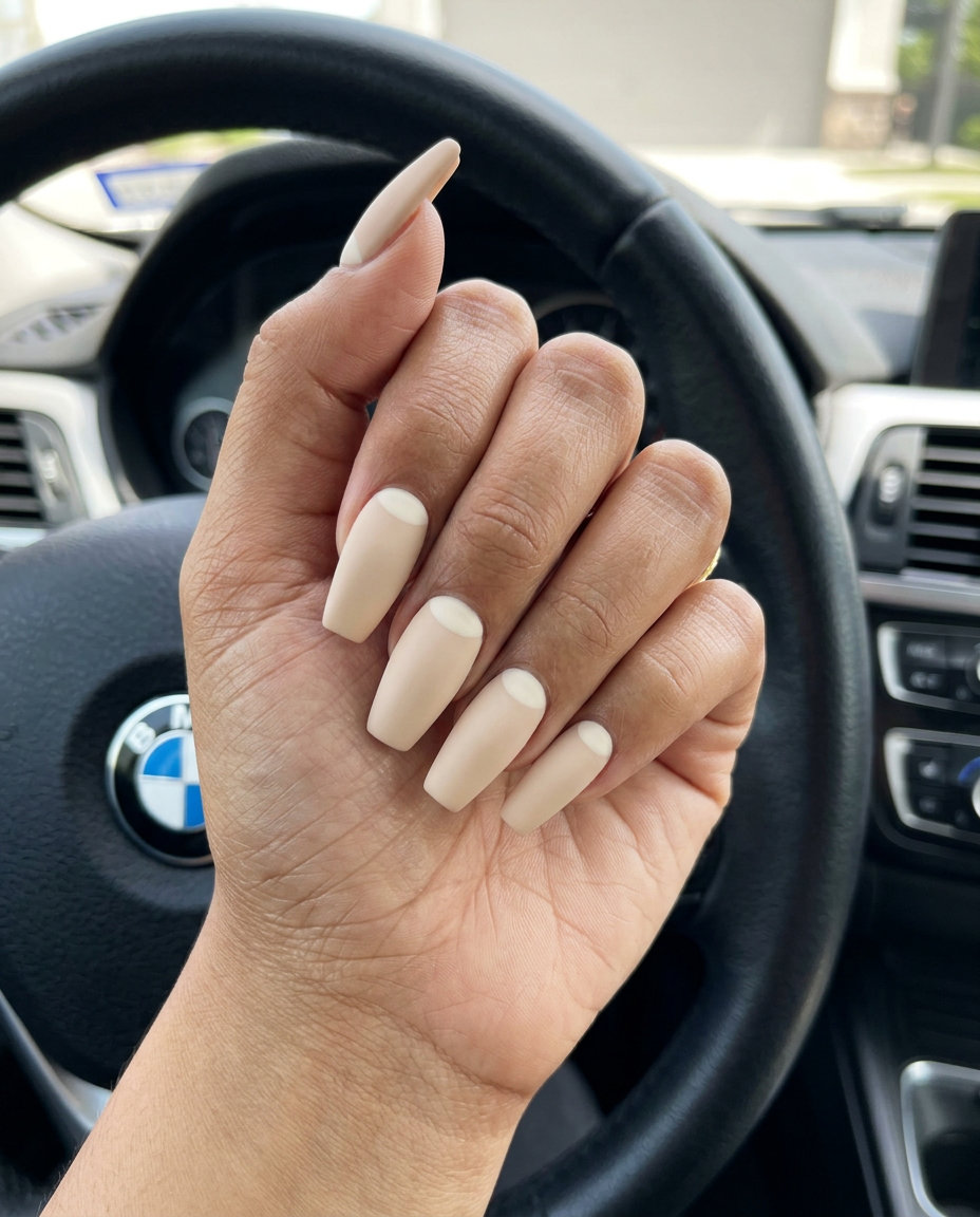 Creamy Beige Matte Nails 2026: Sophisticated Reverse French Creamy Beige Matte Reverse French: Sophisticated matte nails with a pale ivory half-moon at the cuticle.