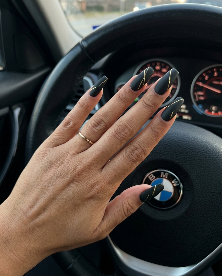 Matte Black With Gold Lines manicure for summer 2026: sophisticated, chic formal event or business meeting nails.