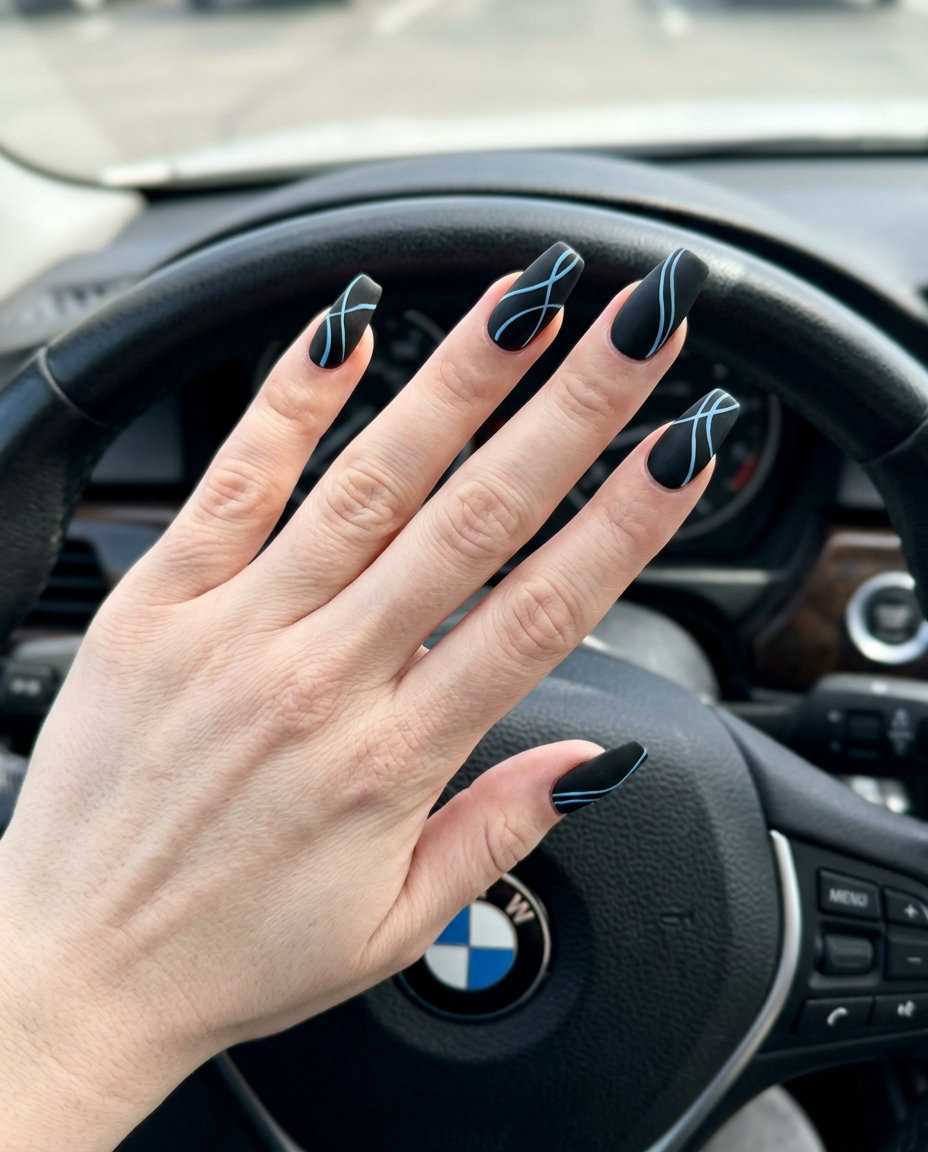 Edgy Matte Blue Line Art Nails 2026 Matte blue line art nails for summer 2026, edgy party look with matte black and baby blue lines on short lipstick nails.