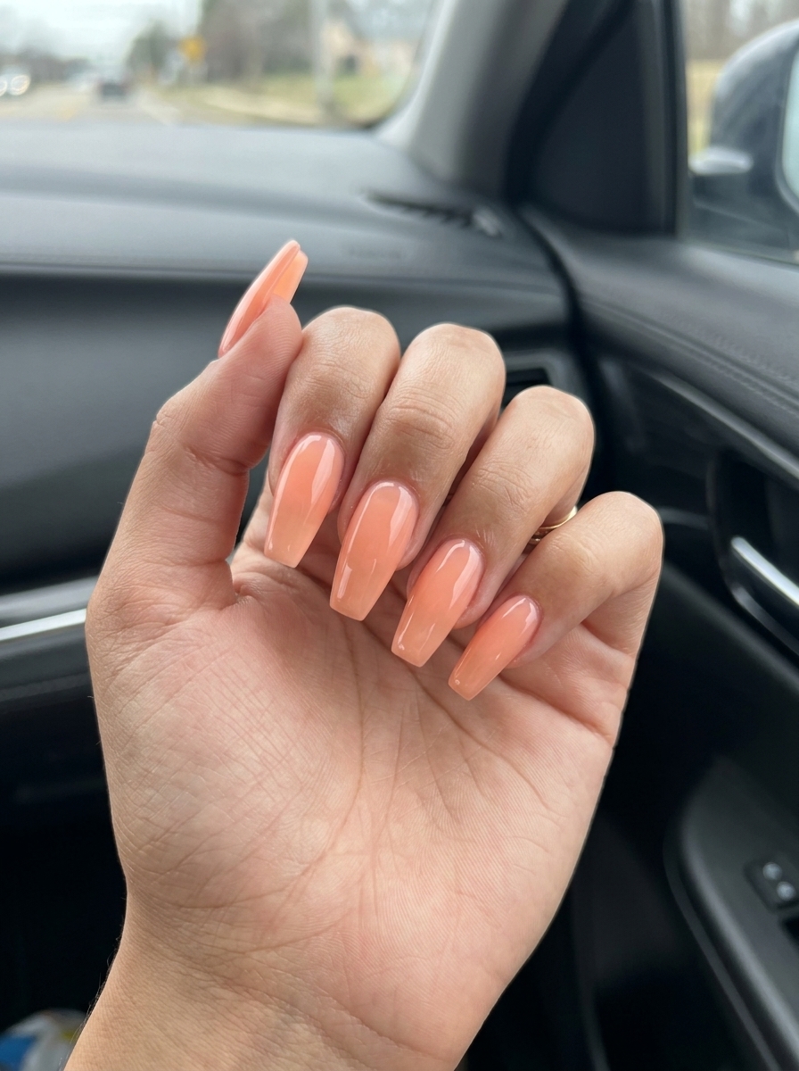 Light peach jelly coffin nails for summer minimalist 2026, playful for vacations and parties.