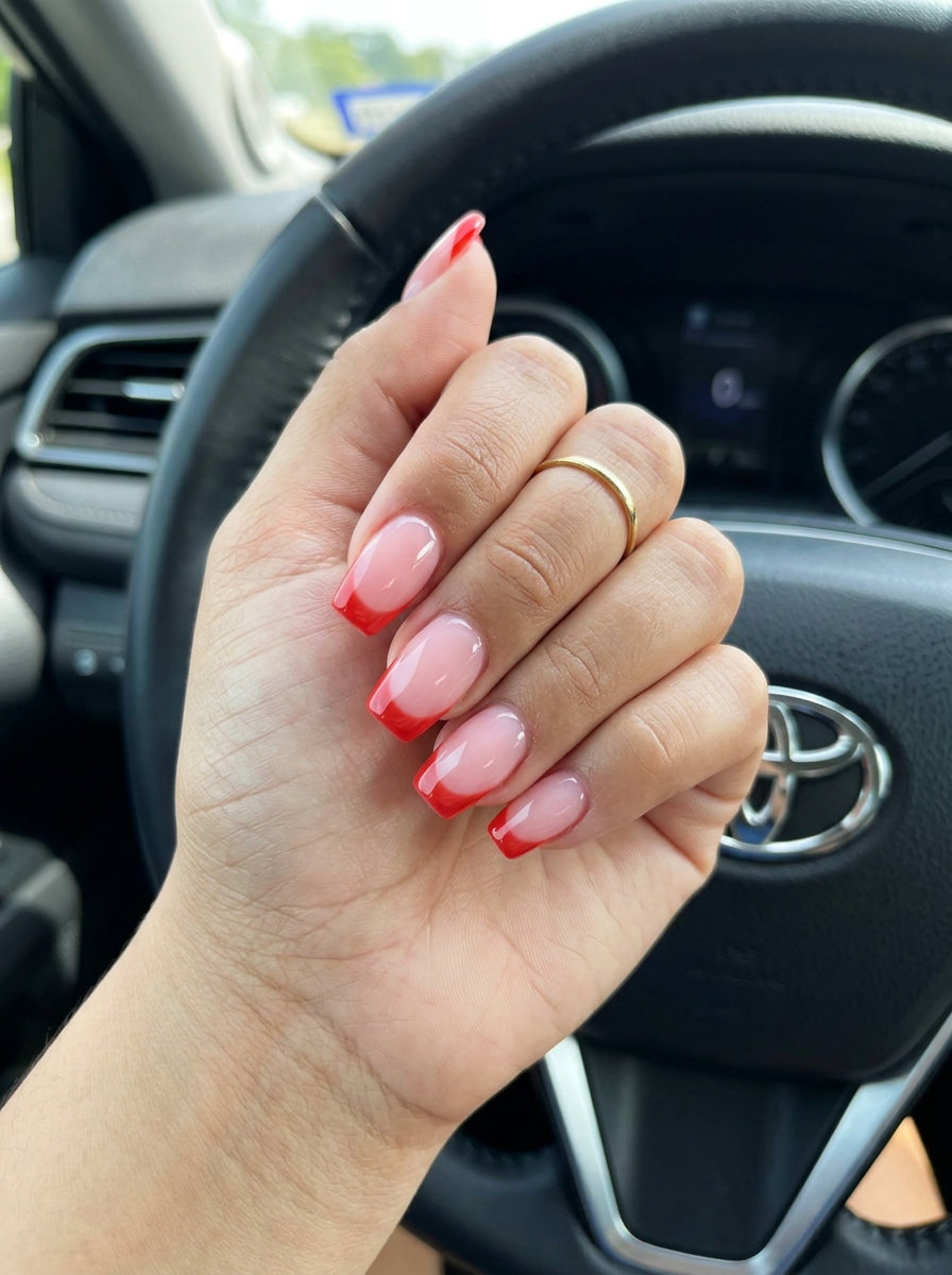 Sheer Tomato Red French Nails 2026 Chic sheer tomato red French tip nails for summer red nails 2026 vacation and casual days.