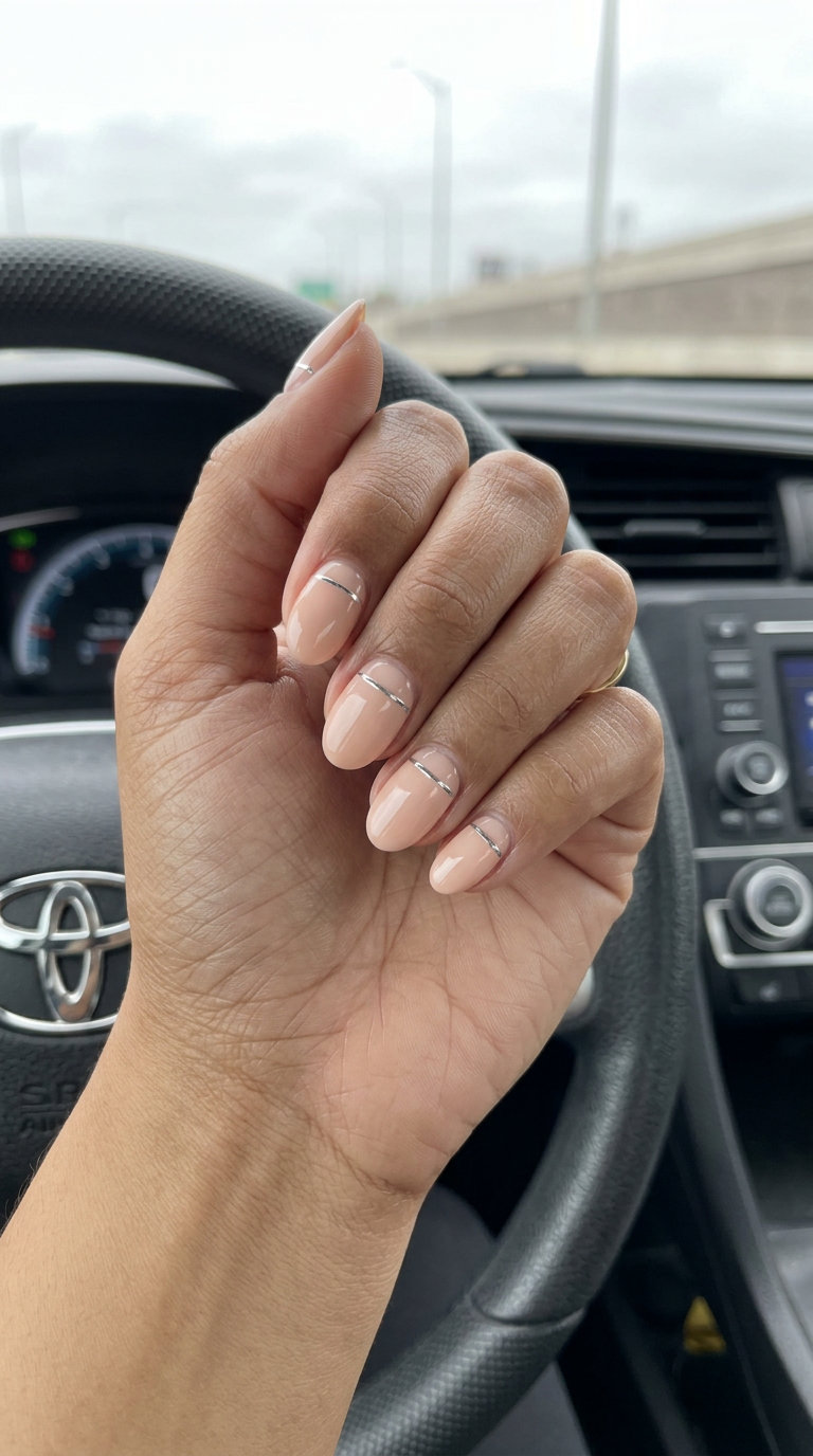 Pale Peach Chrome Nails 2026: Chic Wedding Style Pale peach chrome accent oval nails for summer wedding nails 2026. Chic, minimalist gel polish with silver line.