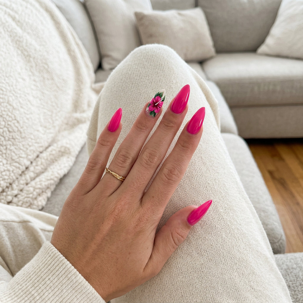 Glamorous pink hibiscus stiletto nails for parties 2026. Bold fuchsia gel polish with floral art.