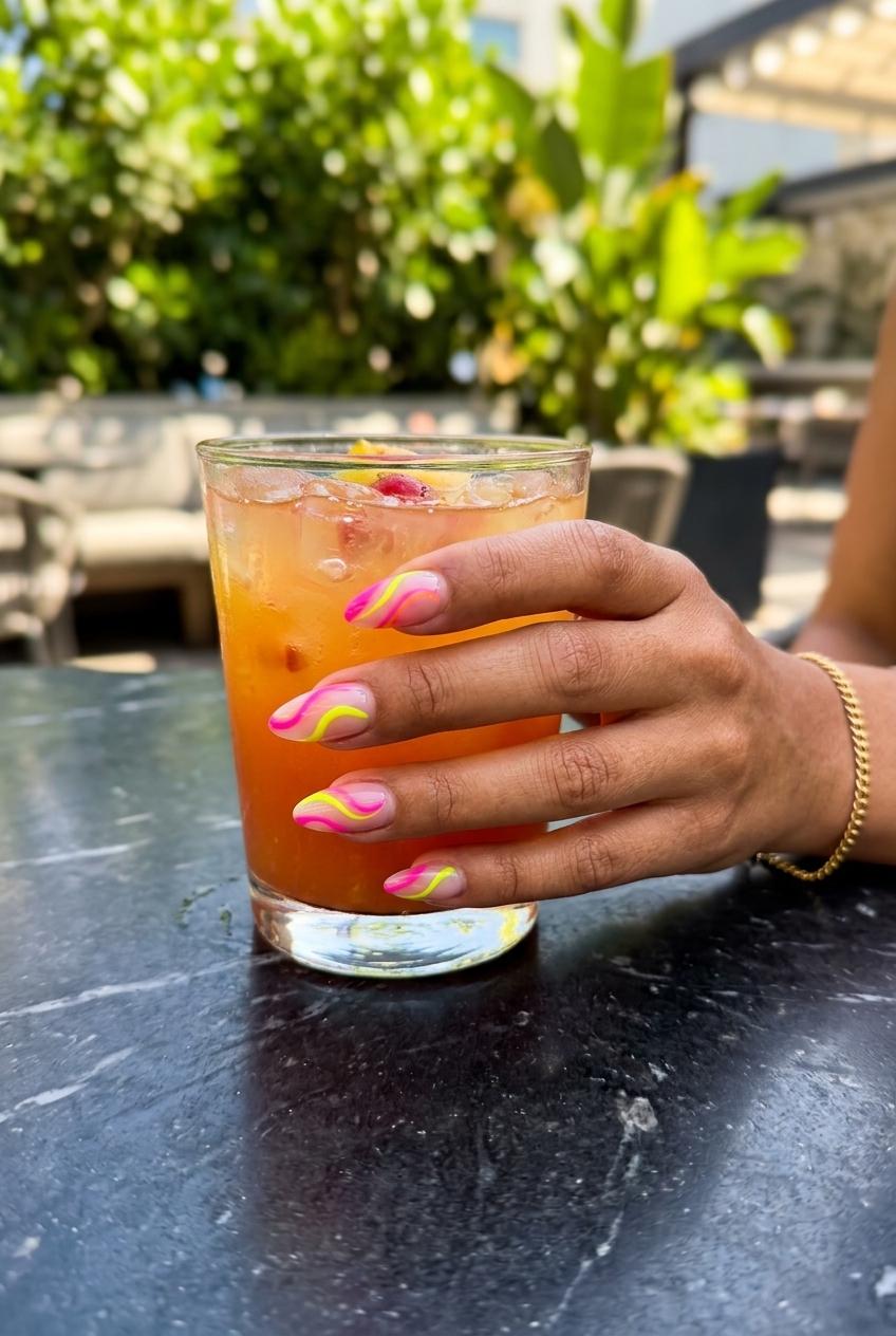 Neon Abstract Swirl Almond nails for tropical summer 2026 festival outfits. Vibrant edgy design.