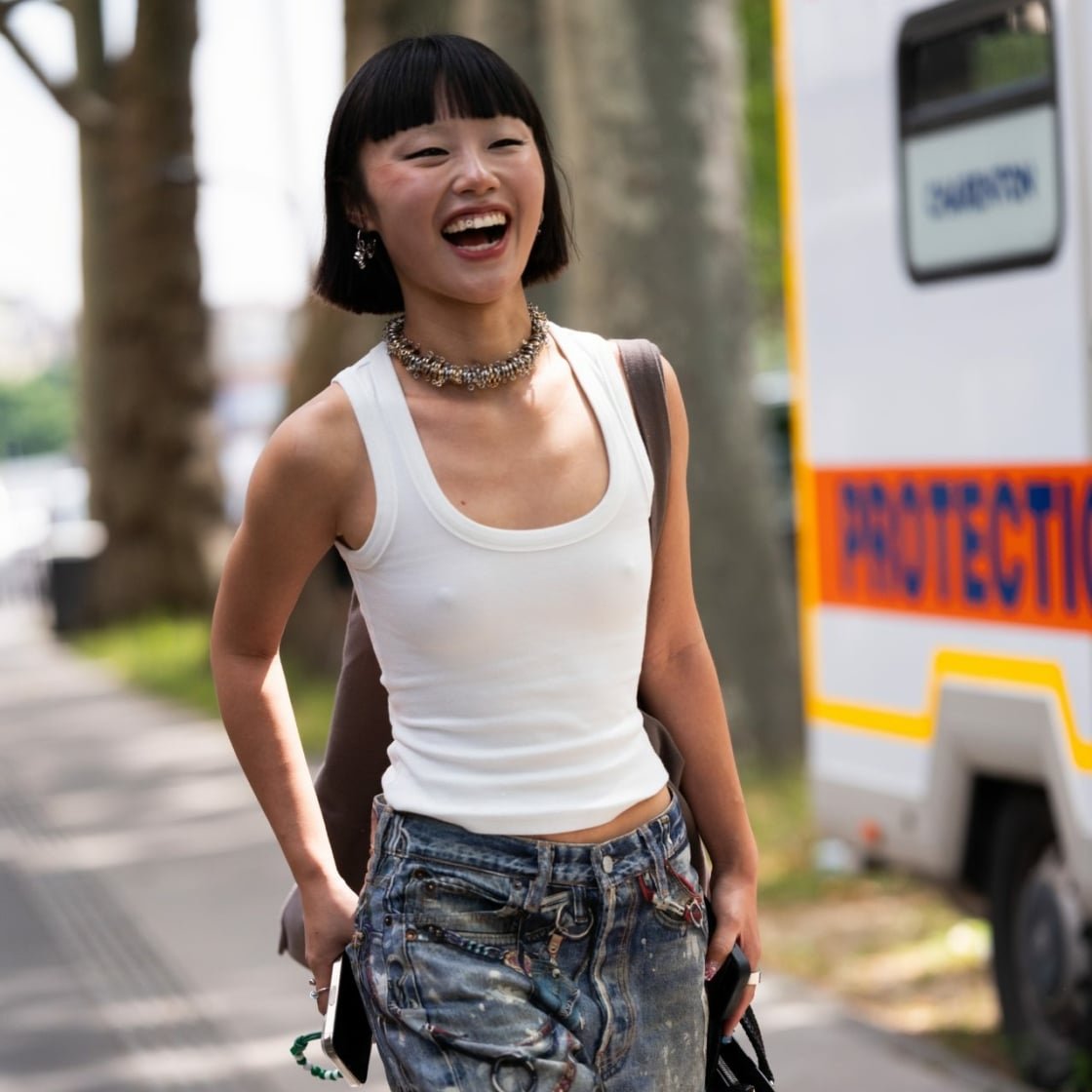 Relaxed Vibes: White Ribbed Tank with Distressed Denim and Statement Necklace — Tank Top Outfits 2027