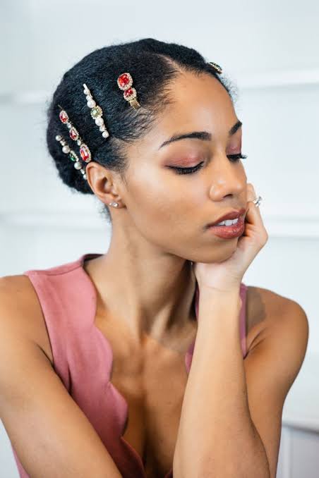 Sleek Low Bun With Jeweled Pins — Holiday Party Hairstyles 2026
