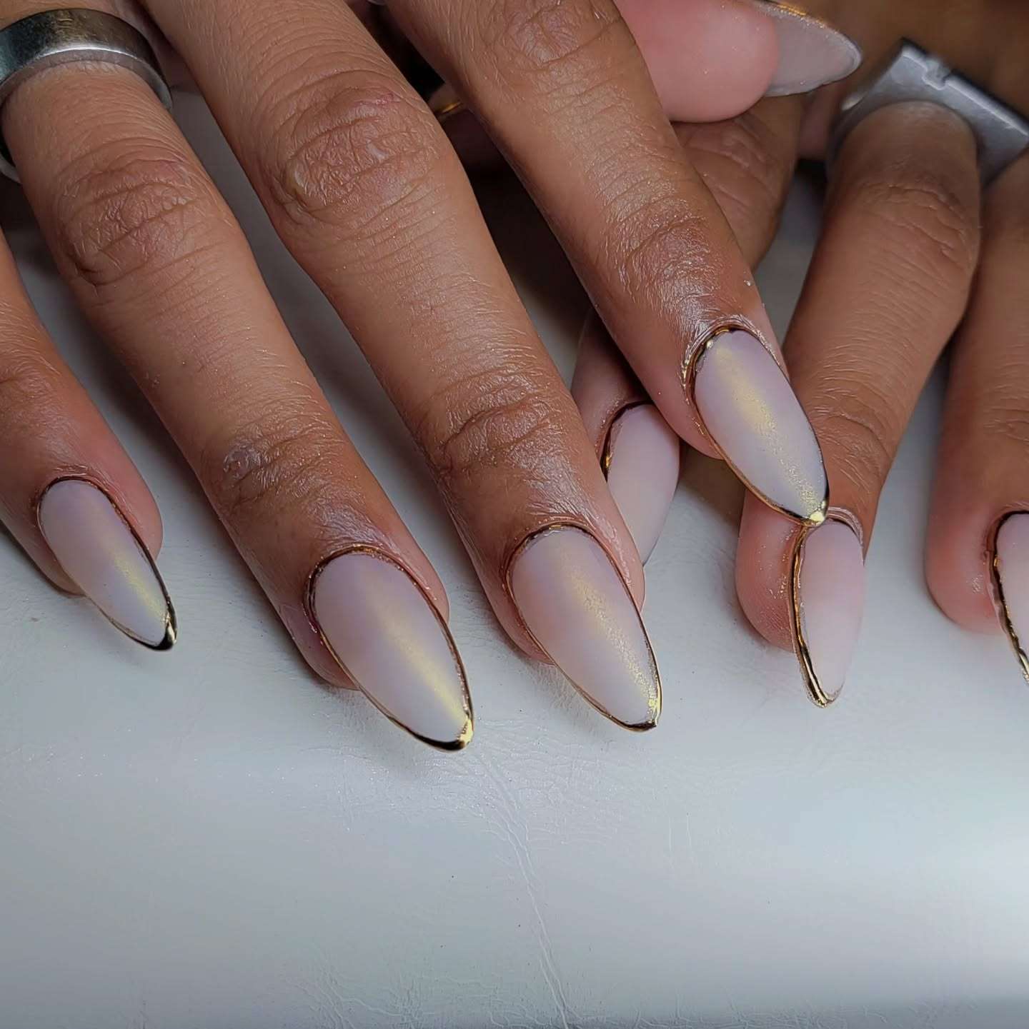 Medium Almond Milky White With Gold Outline Medium Almond Milky White With Gold Outline — Simple Graduation Nails 2027