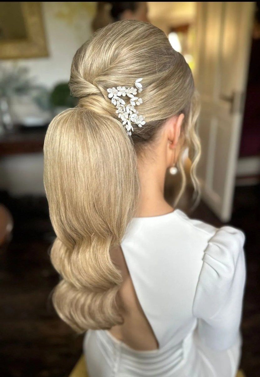 High Ponytail With Sculpted Waves and Accessory — Bridesmaid Ponytail Hairstyles 2027