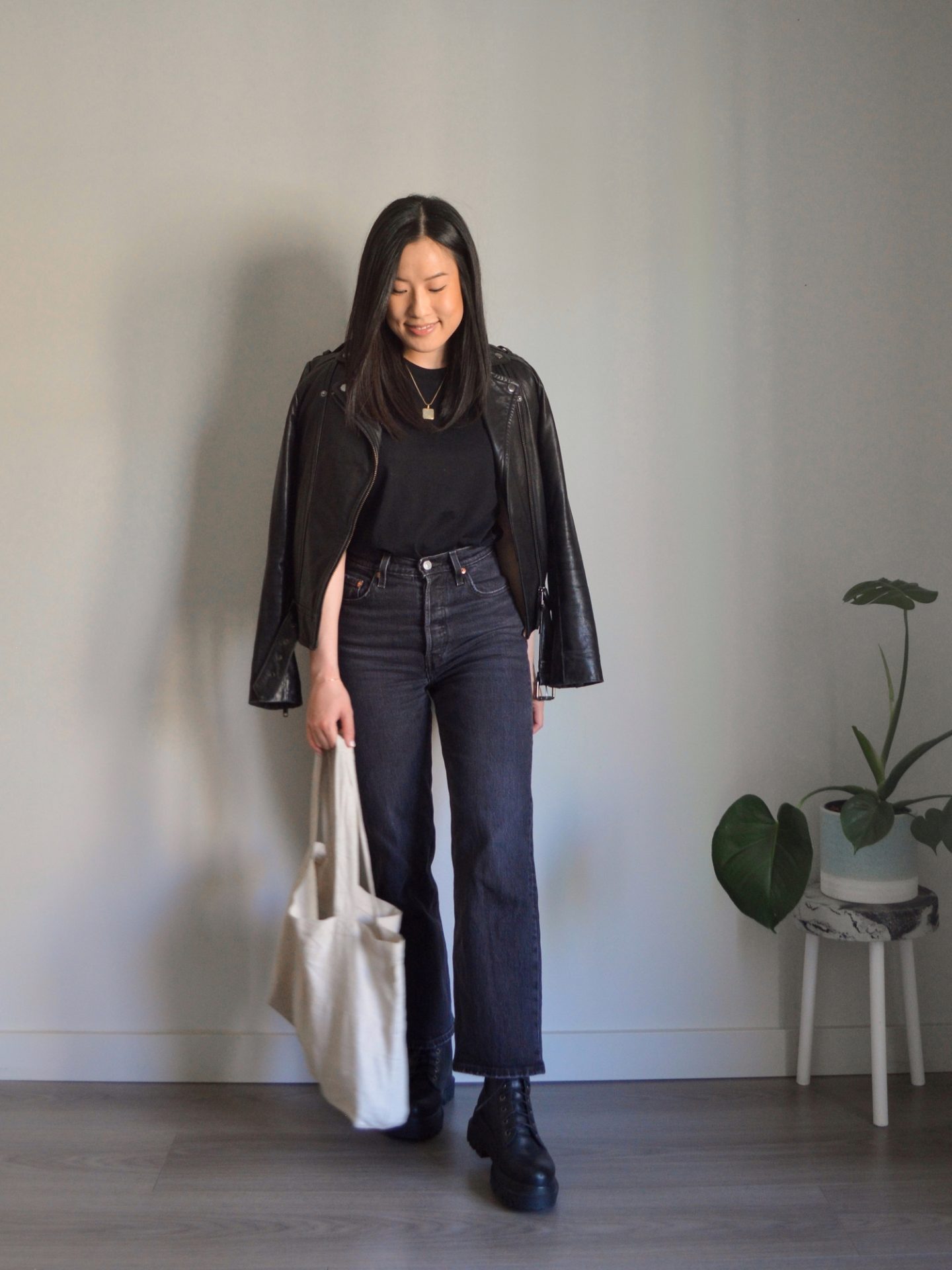 Dark Grey Straight-Leg Jeans Layered Under a Black Leather Jacket Dark Grey Straight-Leg Jeans Layered Under a Black Leather Jacket — Spring Outfits 2027 with Jeans