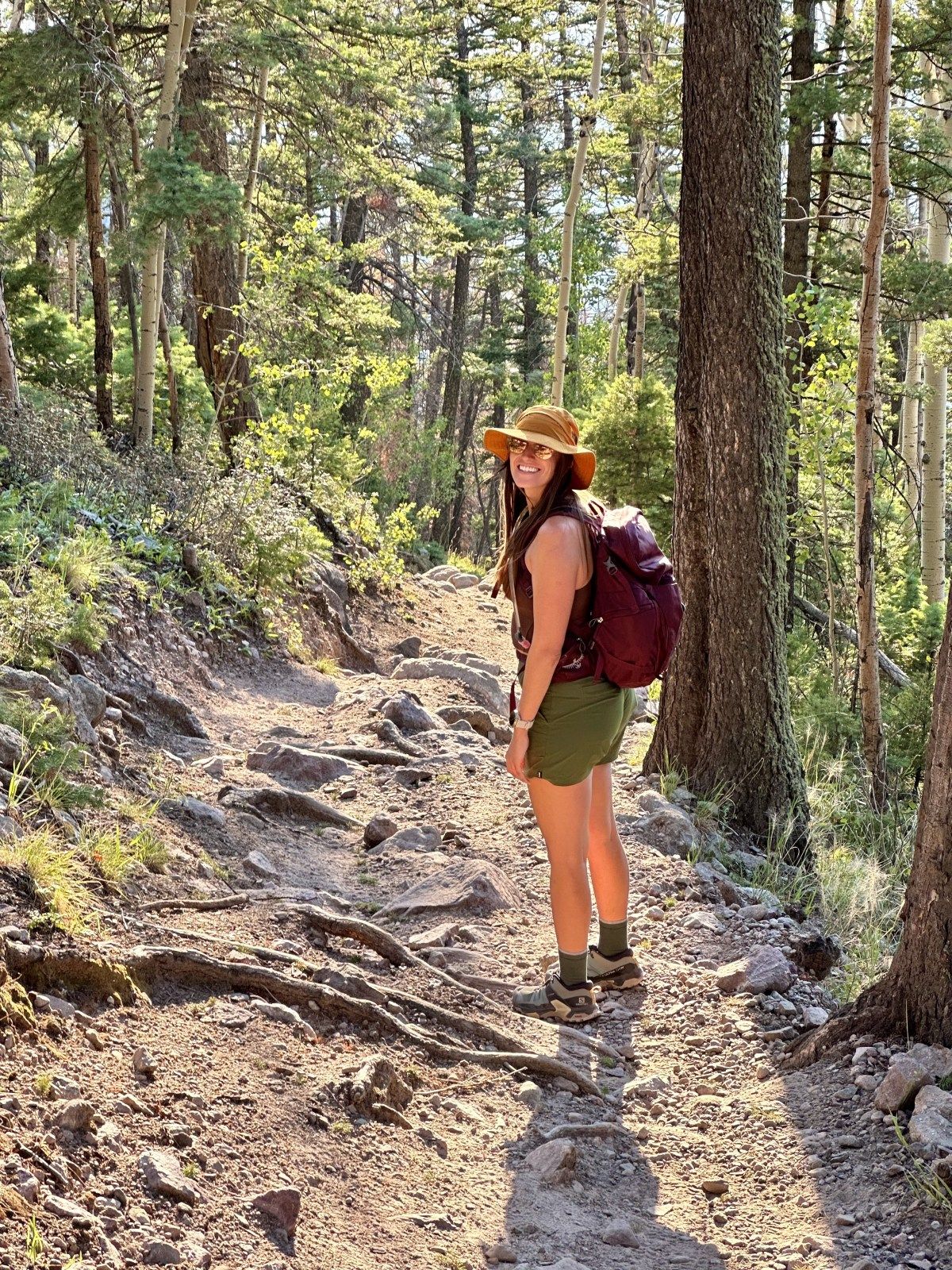 Burgundy Tank Top and Green Shorts with Sun Hat — Athletic Hiking Outfits 2027