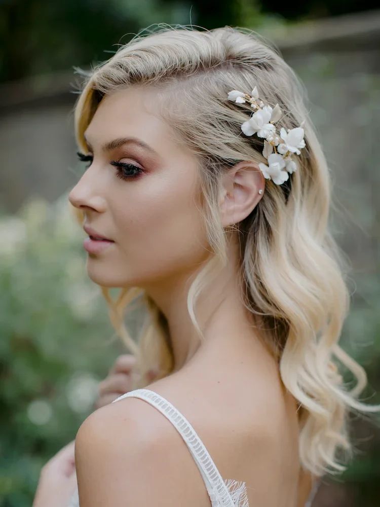 Platinum Blonde Waves With Floral Accessory Platinum Blonde Waves With Floral Accessory — Loose Wedding Hairstyles 2027