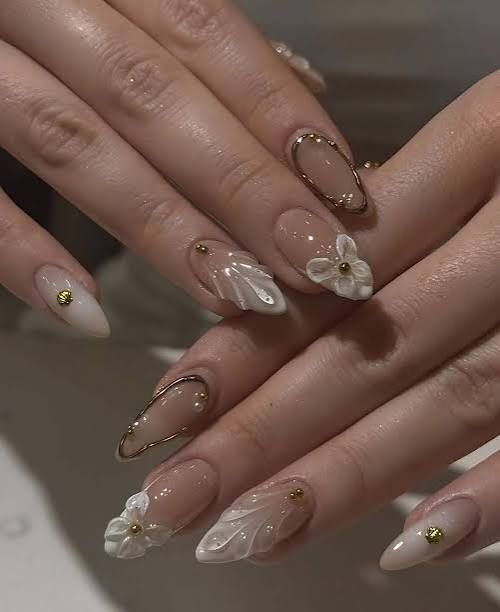 Sheer Nude 3D Floral Gold Foil Almonds Sheer Nude 3D Floral Gold Foil Almonds — Long Wedding Nails 2027