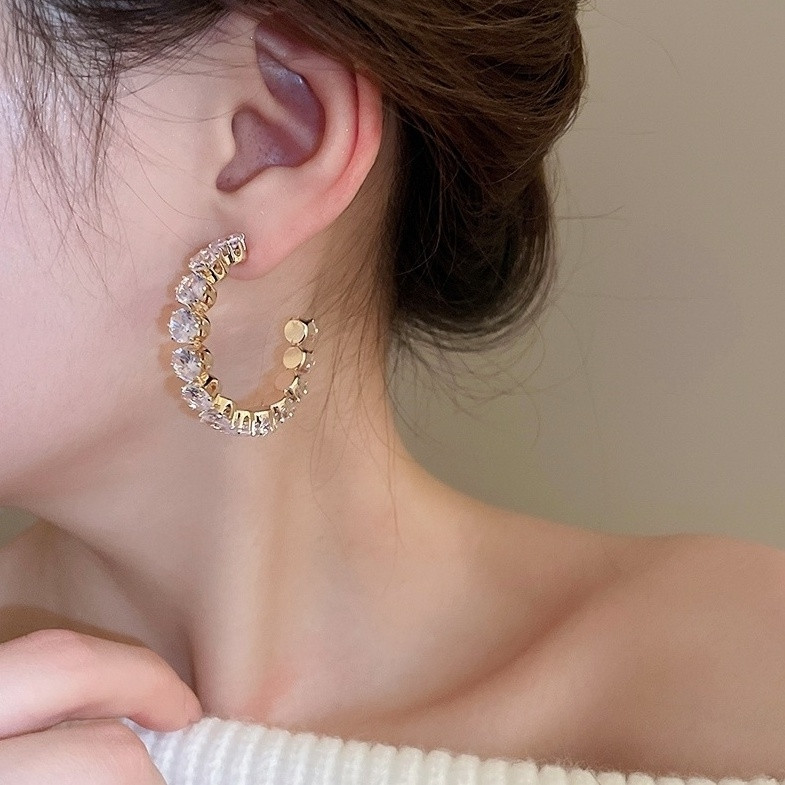 Crystal-Embellished Gold Hoops with a White Knit Top Crystal-Embellished Gold Hoops with a White Knit Top — Hoop Earrings 2027