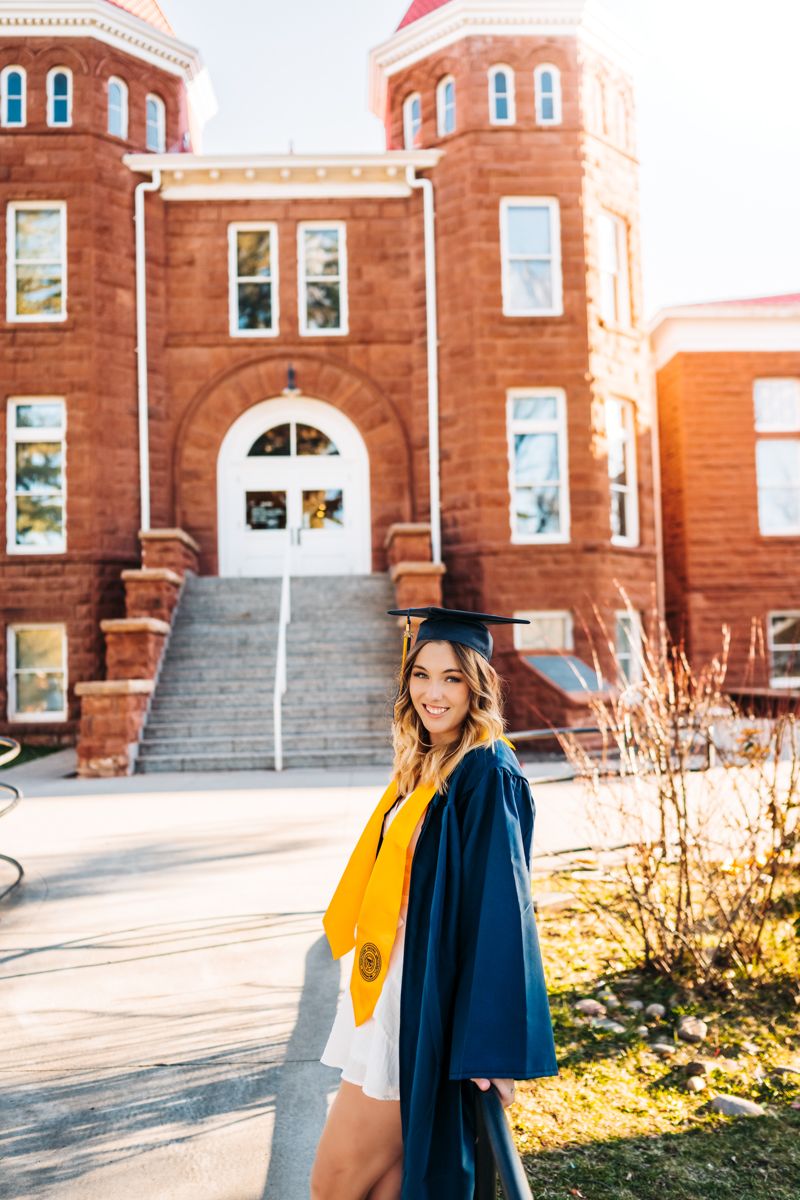 Light Blue Slip Dress Under White Graduation Gown — Graduation Speaker Outfits 2027