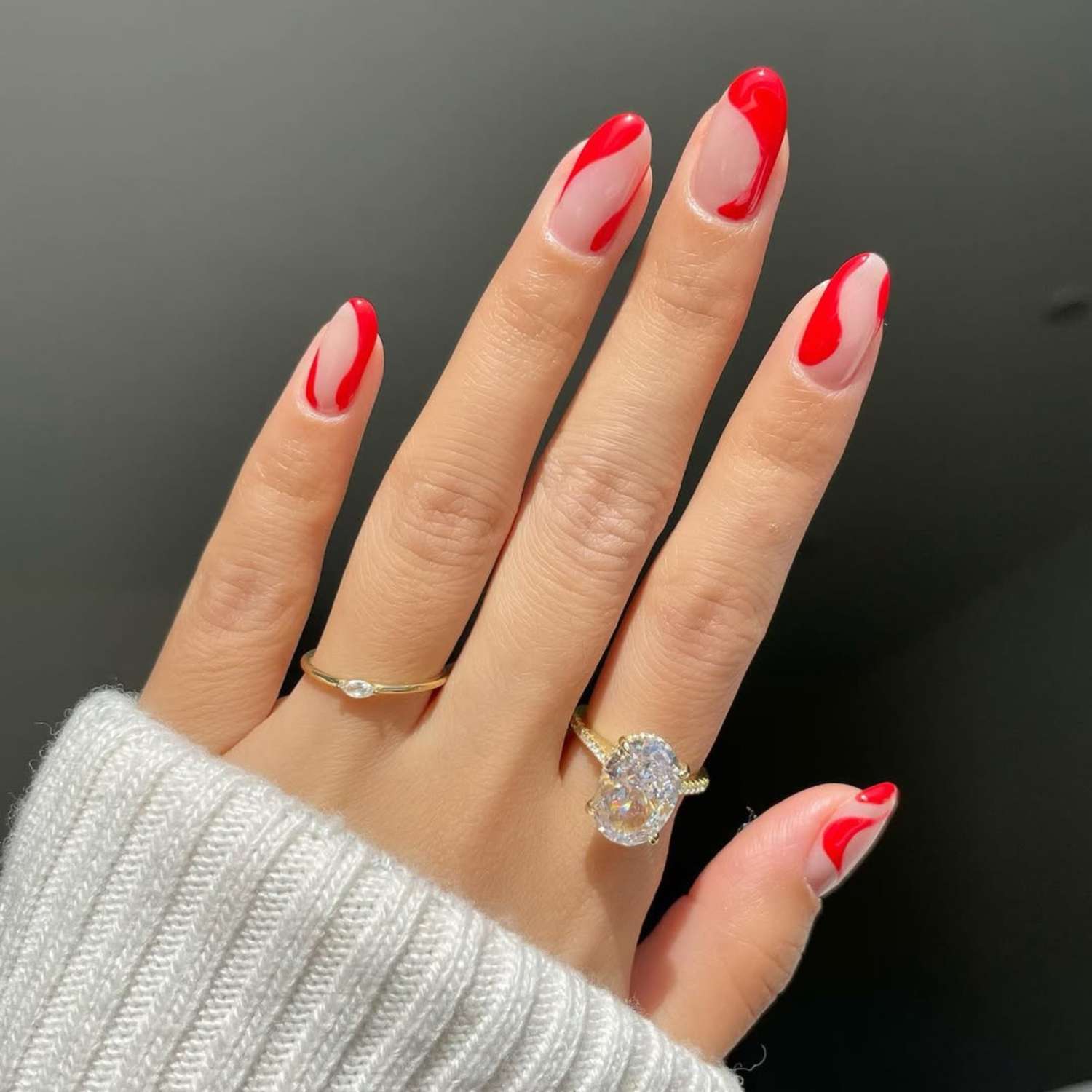 Sheer Nude with Bold Red Swirls — Winter Oval Nails 2027