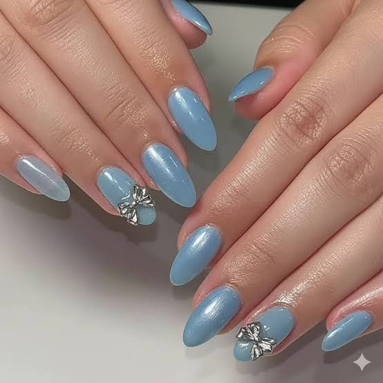 Shimmering Light Blue Almond with Silver Bows Shimmering Light Blue Almond with Silver Bows — Light Blue Quinceanera Nails 2027