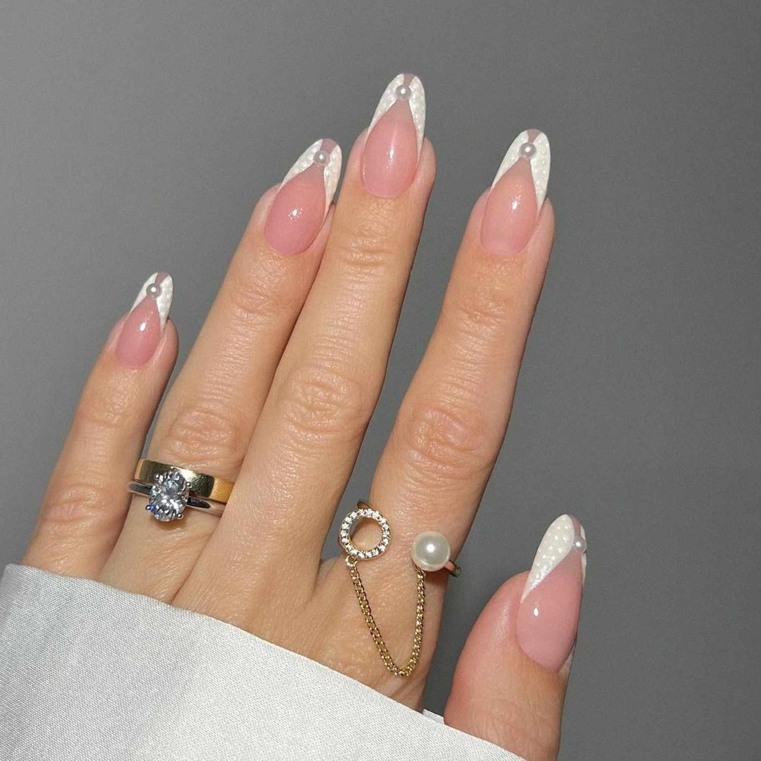 Elegant Celebratory Long Almond Sheer Pink French With Pearls Elegant Celebratory Long Almond Sheer Pink French With Pearls — Simple Graduation Nails 2027