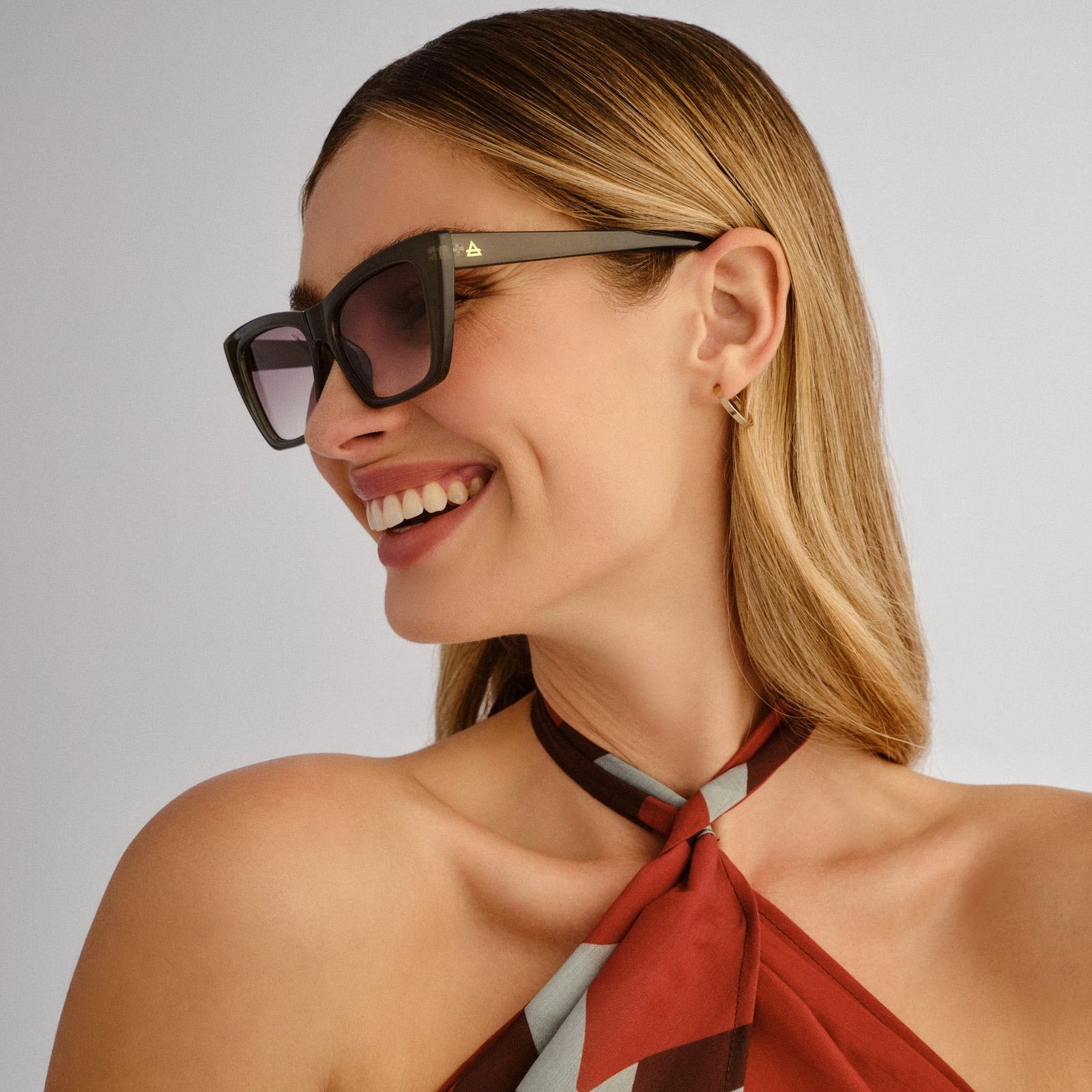Dark Angular Cat Eyes with Patterned Halter Top — Cat Eye Sunglasses Outfits 2027