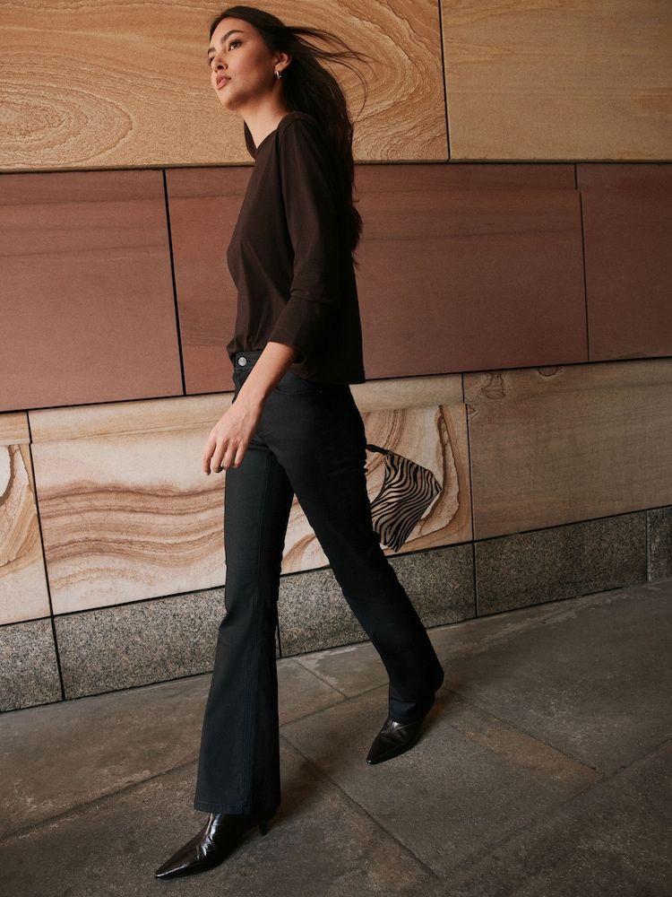 Casual Black Bootcut Jeans with Brown Top and Boots — Black Bootcut Jeans Outfits 2027