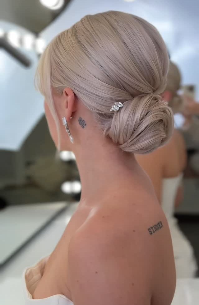 Icy Pearl Blonde Low Bun Updo Icy Pearl Blonde Low Bun Updo — Sleek Bun 2027