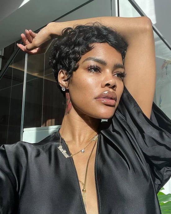 Black Pixie With Defined Short Curls — The Hair Is Styled With A Center Parting Black Pixie With Defined Short Curls — The Hair Is Styled With A Center Parting — Pixie 2027 for Curly Hair