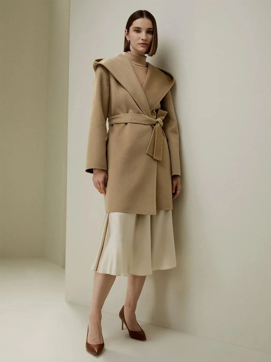 Camel Hooded Wrap Coat with Cream Skirt and Beige Turtleneck — Winter Minimalist Outfits 2027