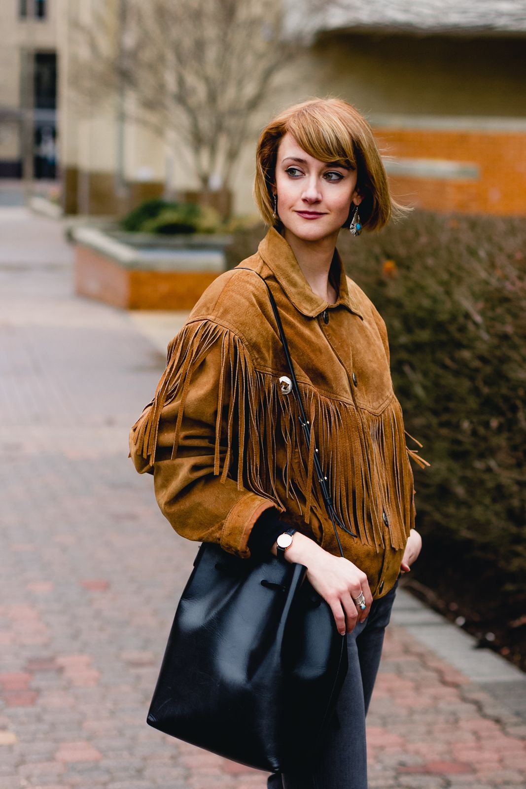 Classic Cool: Brown Suede Fringe Jacket with Grey Jeans and Handbag Classic Cool: Brown Suede Fringe Jacket with Grey Jeans and Handbag — Fringe Jacket Outfits 2027
