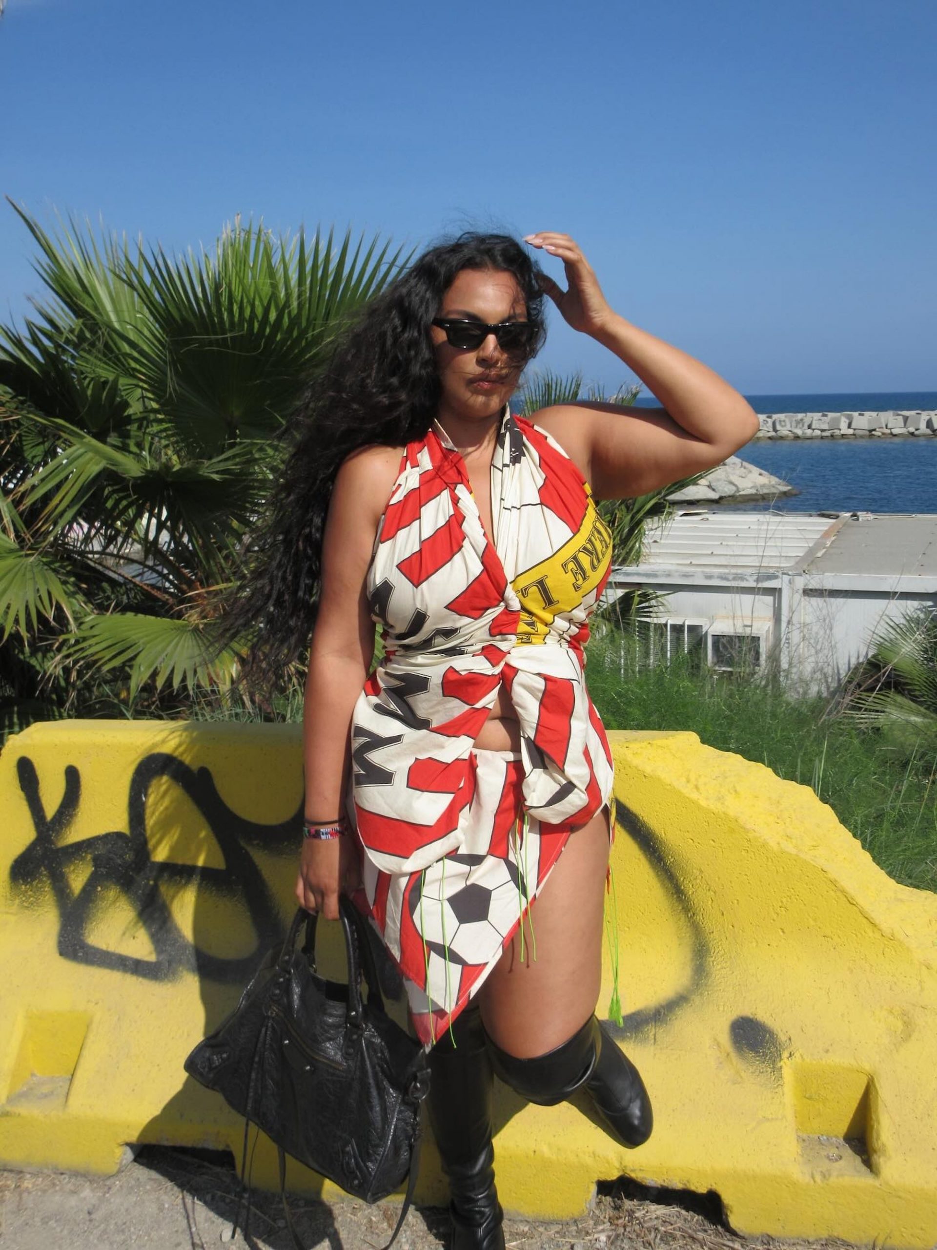 Bold Graphic Print Halter Dress with Knee-High Boots for Spring Break Bold Graphic Print Halter Dress with Knee-High Boots for Spring Break — Spring Break Outfits 2027