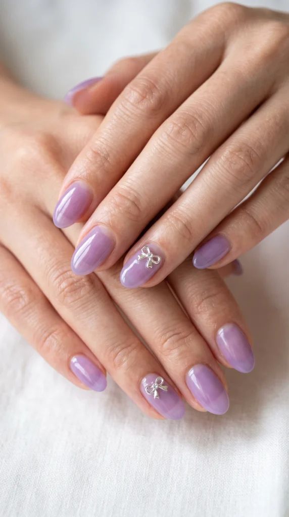 Small Silver Bow Charms On Accent Nails Visual Idea — Pastel Oval Nails 2027